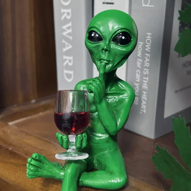 Alien figurine holding wine glass sci-fi decor