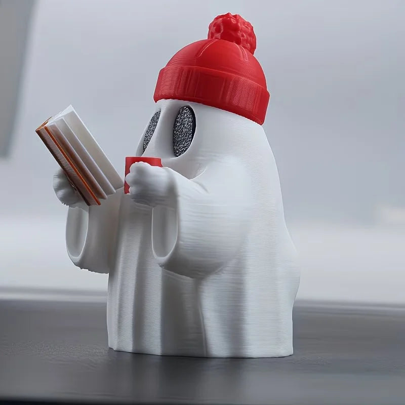 Cute ghost figurine reading a book