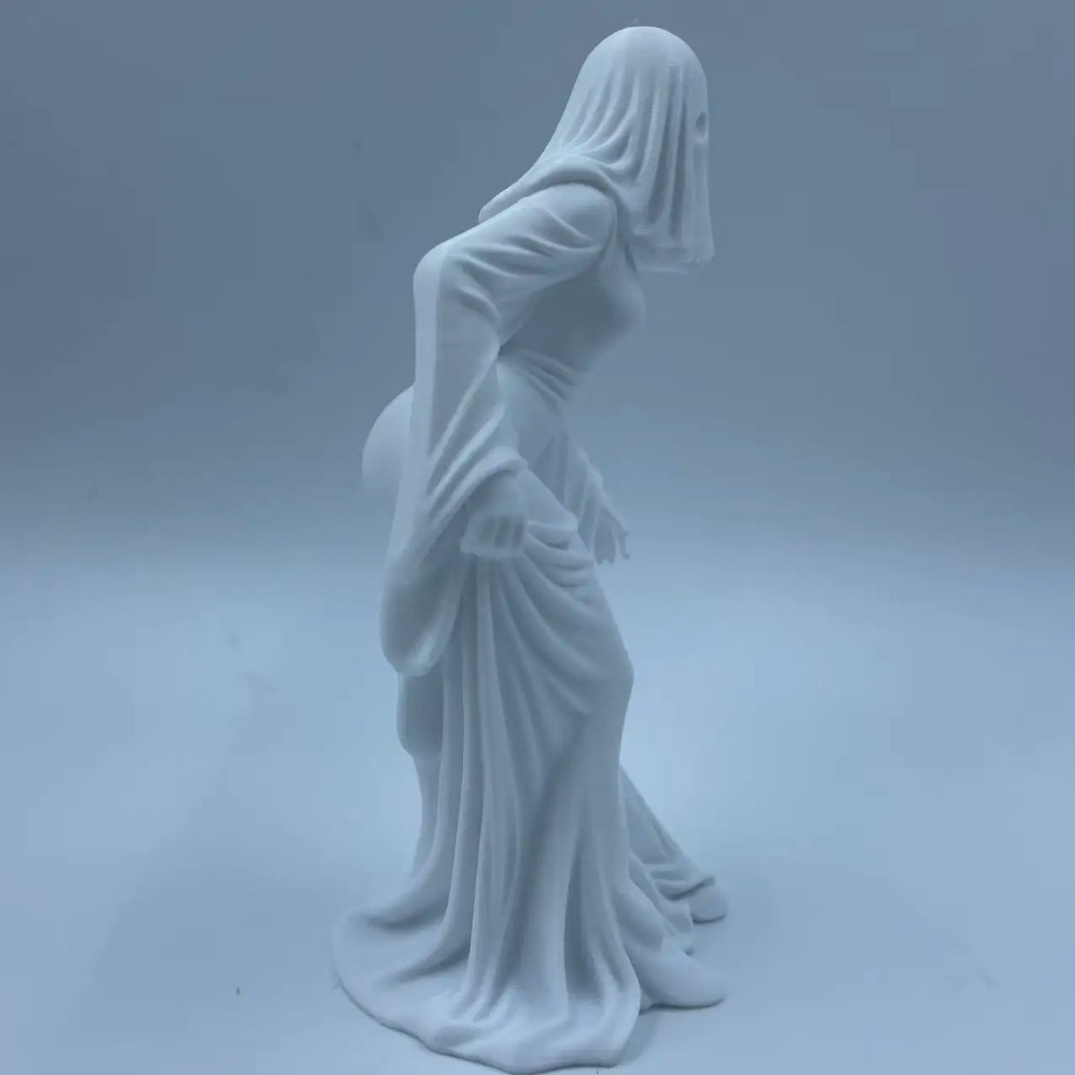 White ghost figurine dark style decor