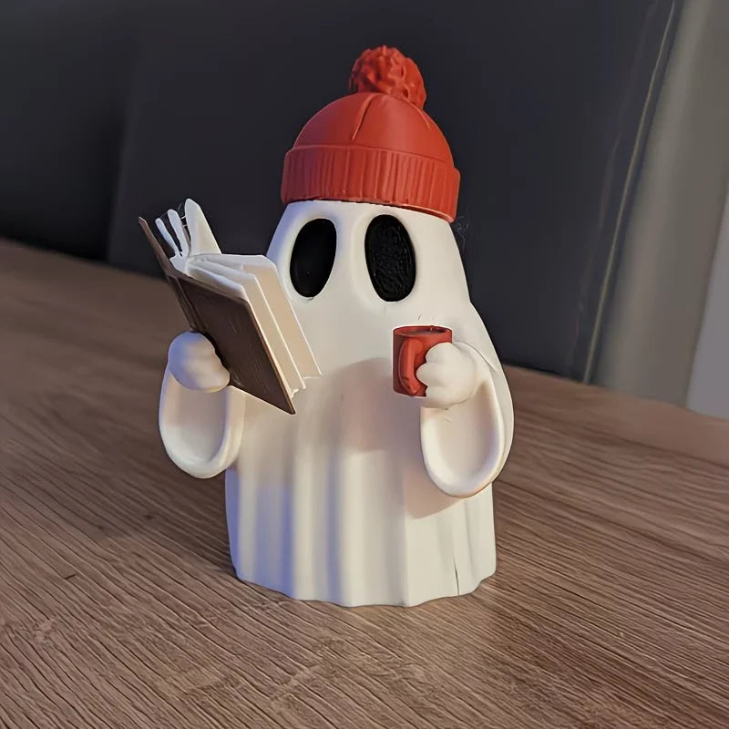 Cute ghost figurine reading a book