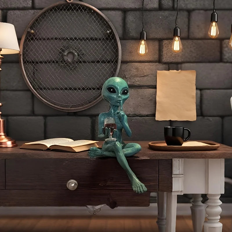 Alien figurine holding wine glass sci-fi decor