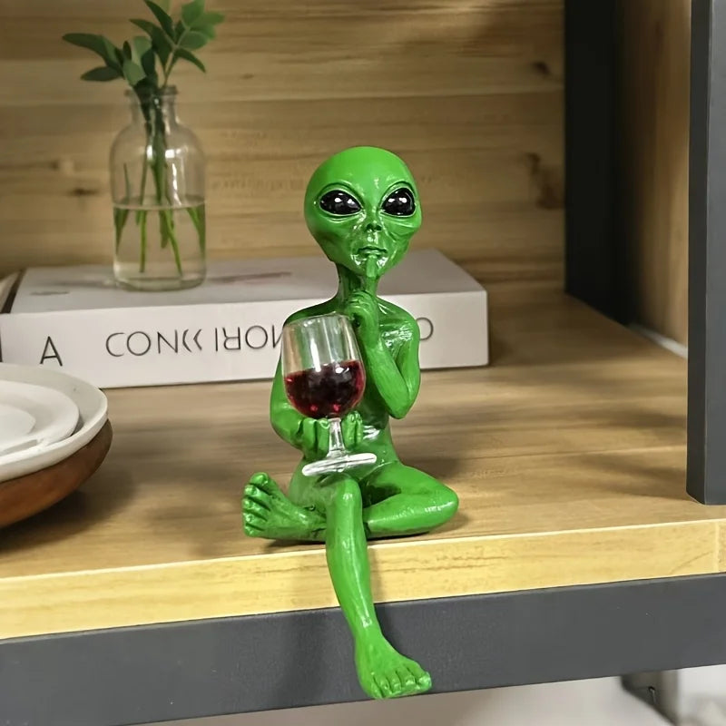 Alien figurine holding wine glass sci-fi decor