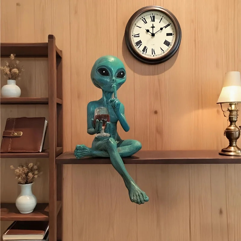 Alien figurine holding wine glass sci-fi decor