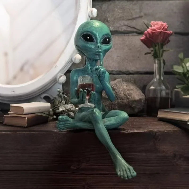 Alien figurine holding wine glass sci-fi decor