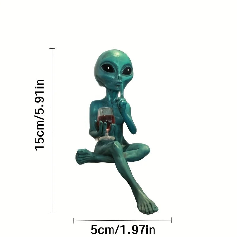 Alien figurine holding wine glass sci-fi decor