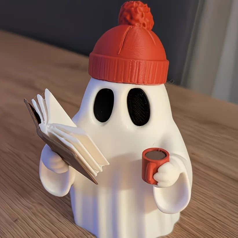 Cute ghost figurine reading a book