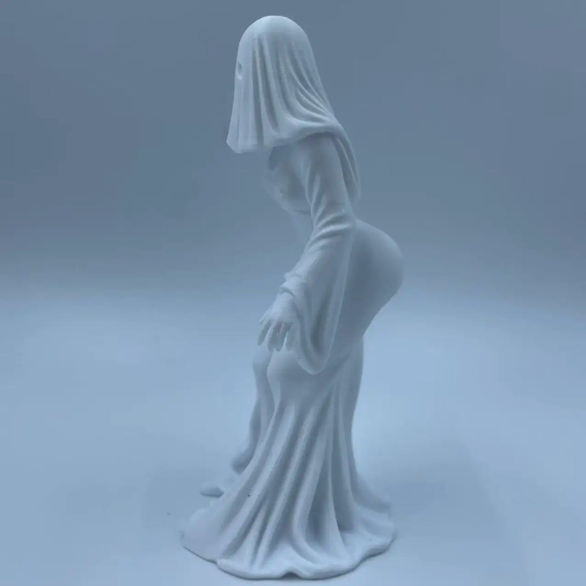White ghost figurine dark style decor