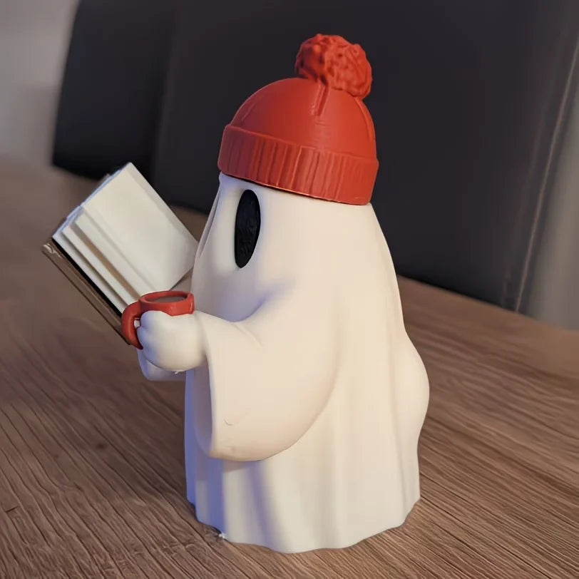 Cute ghost figurine reading a book