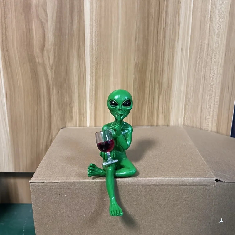 Alien figurine holding wine glass sci-fi decor