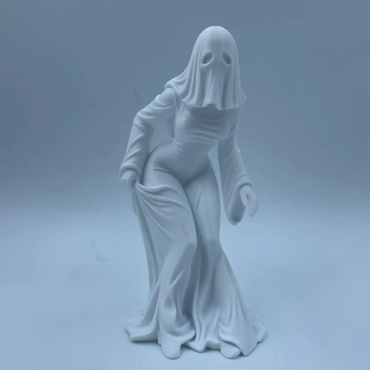 White ghost figurine dark style decor